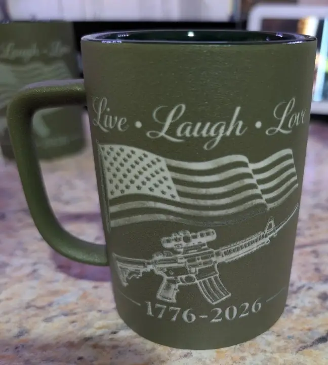 Olive mug engraved with a flag and the words Live Laugh Love
